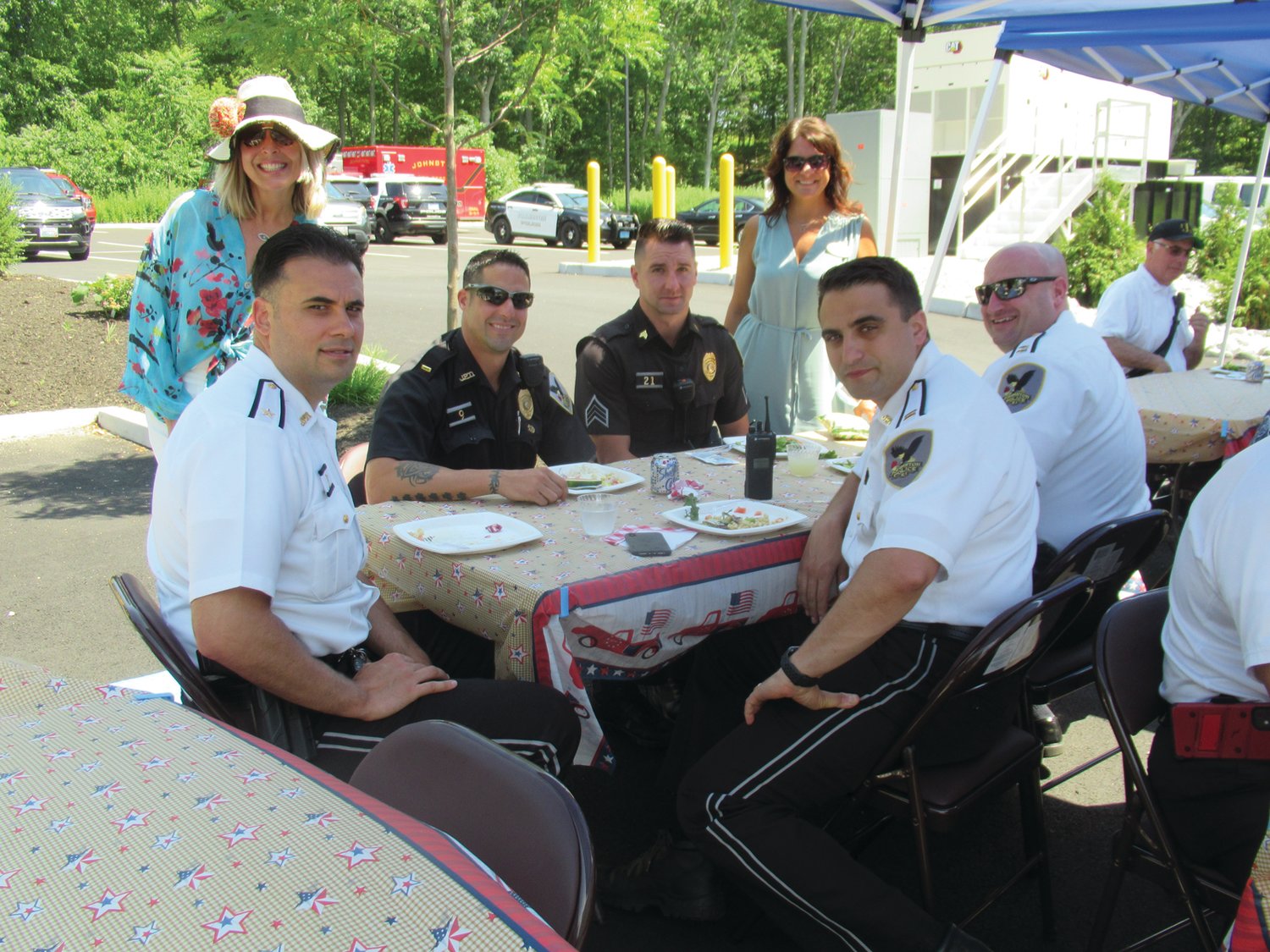 FIRST FORCE: Briarcliffe leaders Stefany Reed and Jen Burns join members of the Johnston Police Department during Monday’s extraordinary First Responders Luncheon-Cookout at recently opened Preserve.